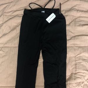 Black flared yoga pants with hip straps